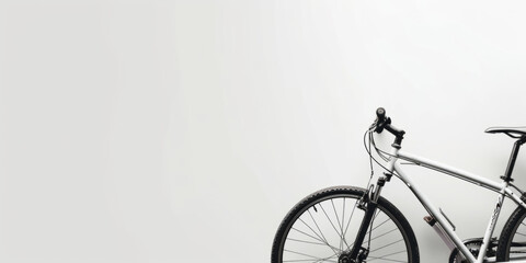 Naklejka premium Bicycle at the side of a banner, providing a wide area for copy space.