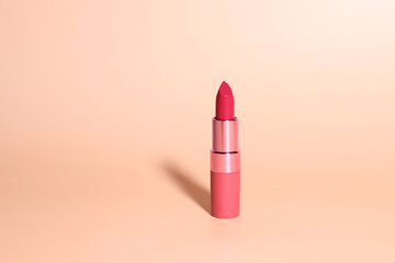 Lipstick mockup, red lip stick cosmetic on beige background