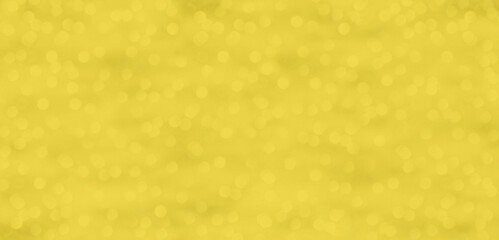Ein glitzernder gelb goldener Hintergrund mit Lichtpunkten