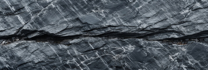 Obraz premium Panoramic dark stone black-white granite texture. Close-up rock banner ad design. Grunge abstract background with copy space