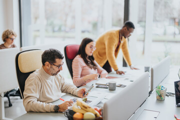 Multiracial teammates, group of business coworkers working together in modern office space.