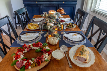 Loaded gourmet holiday table with fine bone China