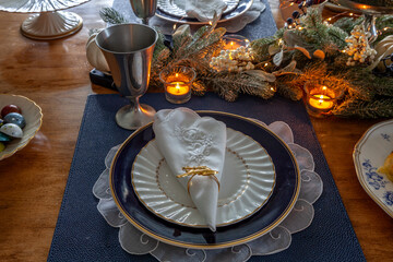 Christmas place setting and greenery on a table