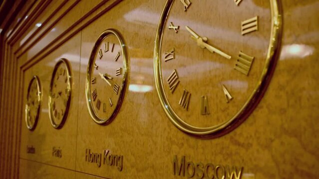 Four clocks on wall show time of London, Paris, Hong Kong and Moscow
