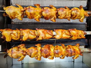 roasting a whole chicken with a rotary machine system. whole roast chicken turning machine.