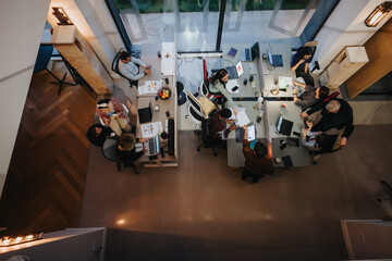 Multicultural team of business professionals engaged in a business meeting at modern office.