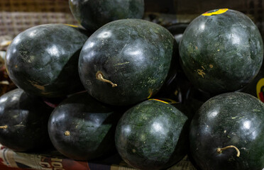fresh juicy watermelon at fruit store for sale at evening