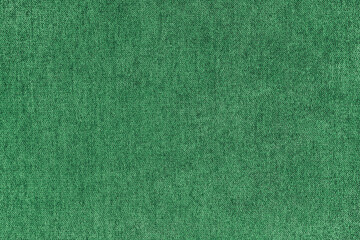 Texture background of velours jacquard green fabric. Upholstery texture fabric, velvet furniture textile material, design interior, decor. Fleecy fabric texture close up, backdrop, wallpaper.