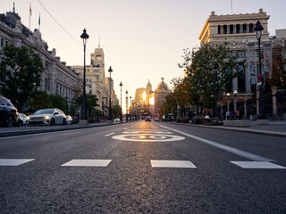 Madrid, Spain - November 19, 2023: Calle de Alcala empty avenue in Madrid under sunset colors - obrazy, fototapety, plakaty