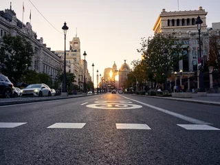 Fotobehang Madrid, Spain - November 19, 2023: Calle de Alcala empty avenue in Madrid under sunset colors © Konstantinos
