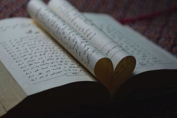 Heart shape with an arabic book
