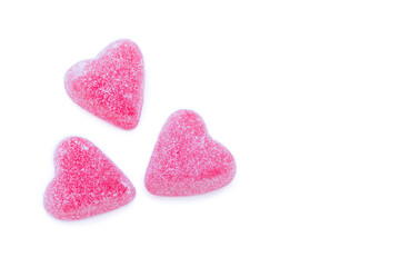 Obraz premium Border of pink sugared marmalade hearts on white background.