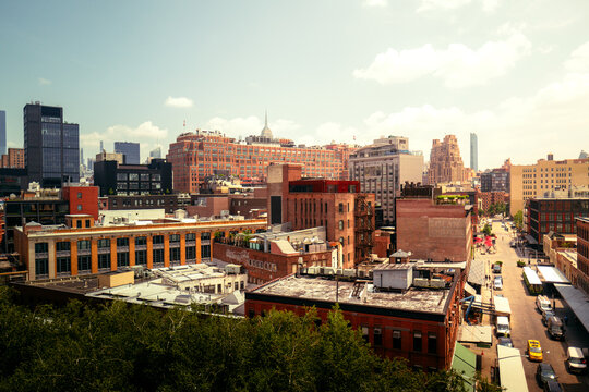Manhattan, New York City, Meat Packing District overlooking Greenwich and west village in bright, warm and cinematic daylight. Skyscrapers and traditional American red brick buildings