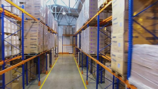 Rows of shelves with many boxes in warehouse of Sinikon plant