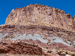 Ancient rock formations tower above the abandoned Oyler Uranium Mine entrance at Capitol Reef National Park, Utah, USA © davidrh