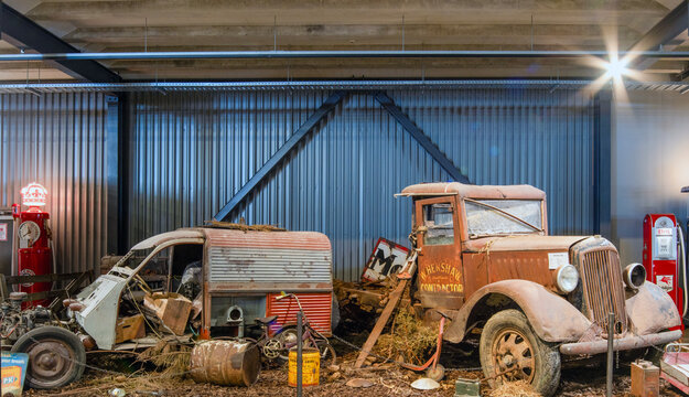 Invercargill, South Island, New Zealand- 13 November, 2023: Decayed vintage truck and old-time garage setup, capturing a bygone era at Transport World Museum, Invercargill.