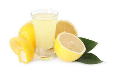 Shot glass with tasty limoncello liqueur, lemons and green leaves isolated on white