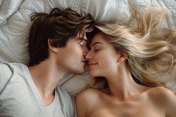 Passion and desire intertwine as the man and woman share a tender kiss on the bed, their faces illuminated by the glow of love and romance, with the bride's delicate skin pressed against her lover's 
