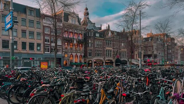 Traditional old narrow houses boats and canals in Amsterdam, Netherlands, Europe, January 20, 2024. High quality 4k footage
