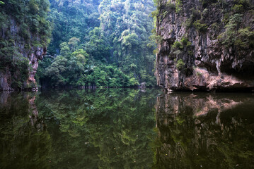 Tasik Cermin or Mirror Lake, Ipoh, Malaysia - Tasik Cermin, or Mirror Lake, is a stunning hidden lake surrounded by limestone karst towers. Located near Ipoh town, Perak state, Malaysia.