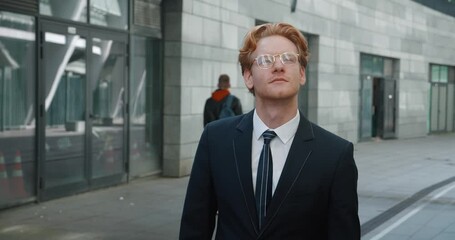 Man in formal suit goes to interview, thinking positively about upcoming conversation with employer. Man energetic and purposeful steps reflect confidence. Concept important moment in man career.
