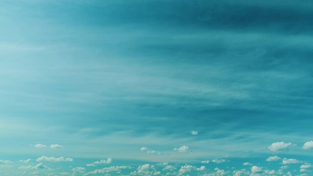 Altostratus spissatus flying clouds causing water vapour to condense. White and blue altostratus clouds background.