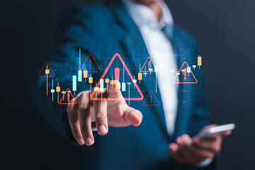 Business investment risks. Businessman use smartphone with virtual stock growth graph with red...