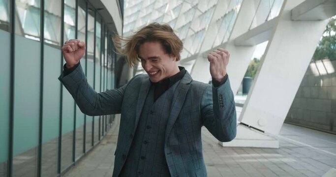 Radiating emotion of sheer joy stylish man exudes confidence and pleasure Emotion display is testament to his energetic success. Strong emotions of happiness echo his stylish confidence.