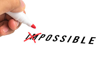 man hand crossed mark on impossible text to possible isolated on white background. concept of...