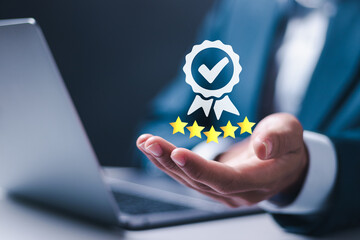 ISO service concept. Businessman holding virtual sign of top service Quality assurance with five...
