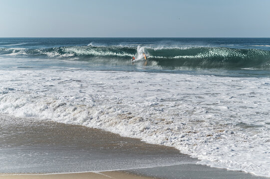 Surfing wipe out in Zicatela beach, Oaxaca, Mexico