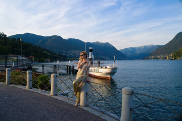 Woman tourist, summer fashion style, travel to Europe. Fashion tourist. Elegant woman tourist in...