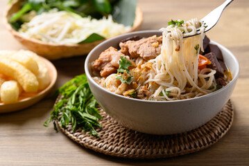 Northern Thai food (Kanom Jeen Nam Ngeaw), Spicy rice noodles soup with pork and pork blood eating with fresh vegetables
