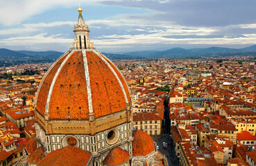 The majestic dome of Cathedral Santa Maria del Fiore overlooks the old town of Florence~Florence's...