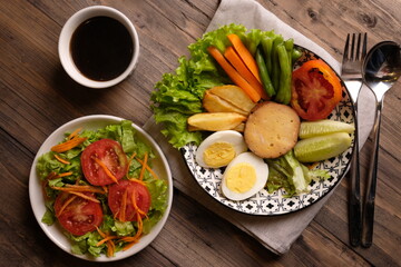 Selat Solo is a typical dish of Solo, Central Java, made from processed beef, fresh vegetables, eggs, french fries, boiled carrots. served with meat broth and mayonnaise sauce. Indonesian food. 