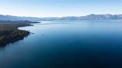 Panoramic view of Lake Tahoe, California coastline with mountains landscape 