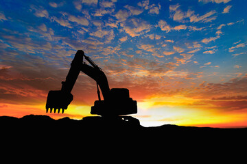 Crawler excavators silhouette are digging the soil in the construction site. on the sky  and ...