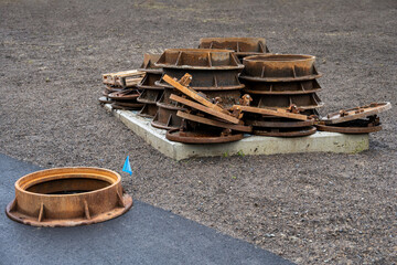 New residential community under construction, pile of sewer drain covered ready to be installed
