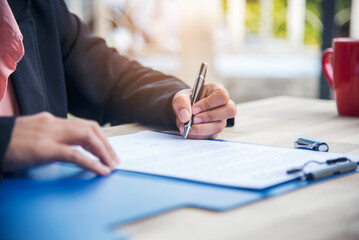 Close up businesswoman hands manager signing reading business contract document. Businesspeople...