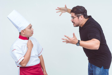 An angry man, possibly customer or restaurant owner, lectures a chef about poor food quality and service. Isolated on a white background.