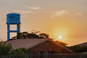 blue tank water and a beautiful sunset in the desert