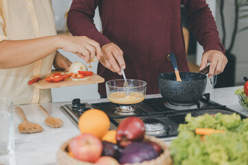 Senior Asian People elder happy living in home kitchen. Elderly  cooking in a kitchen. Happy mature man and woman in the kitchen, Active seniors. Older people relationship and activity