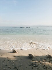 Beautiful view of waving blue sea and sky in tropical summer, Pangandaran beach, Java, Indonesia. Travel or vacation