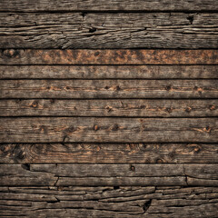 close-up of a wooden surface, with planks of wood. The grain of the wood is visible, and there are some visible knots