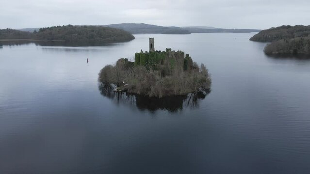 McDermott Castle on an island in Lough Key, Roscommon, Ireland, surrounded by calm waters