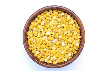 Split chickpeas in a wooden bowl on white background top view 