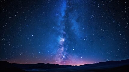  the night sky is filled with stars and the milky shines brightly above the mountains and the valley below it.