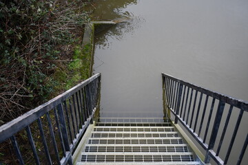 Stairs heading into flooded area.