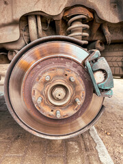 A brake disc on a removed car wheel