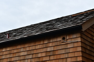 New construction, outdoor lighting ready to install, wire hangs from open hole.